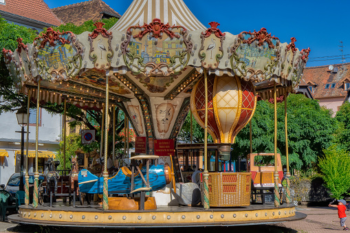 Strolling through the centre of Obernai, we came across this magnificent old merry-go-round. Obernai, France.
