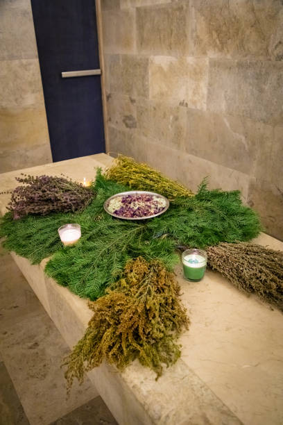 Fragrant bath brooms decorate the table in the hammam