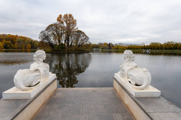 Schwerin, Germany, September 13, 2016 - Statue holding an umbrella on the shore of lake Pfaffenteich in Schwerin.