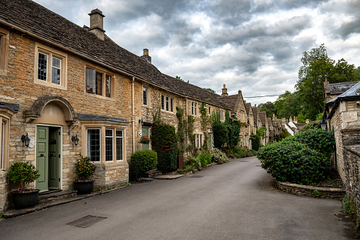 Picturesque Village Castle Combe In The Cotswolds Area In Wiltshire In England, United Kingdom