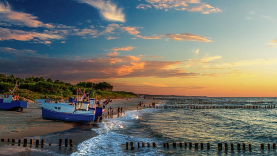 Evening walks on the Baltic Sea beach at sunset