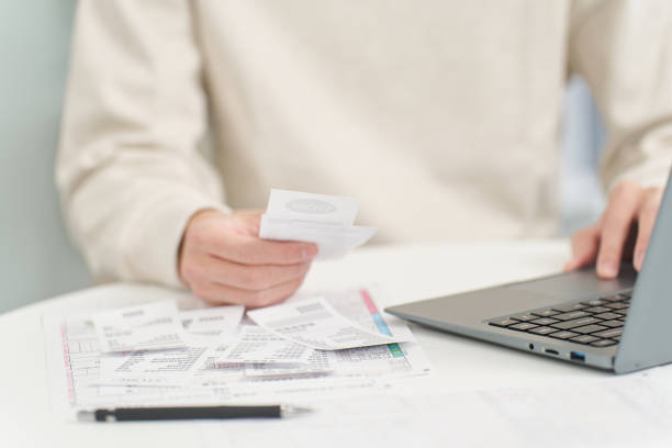 istock Hand of a man entering expenses into accounting software 2034948842