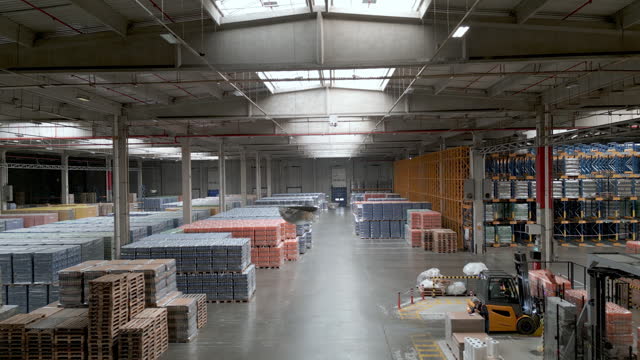The fully automated bottling plant's stacked warehouse filled with ready product