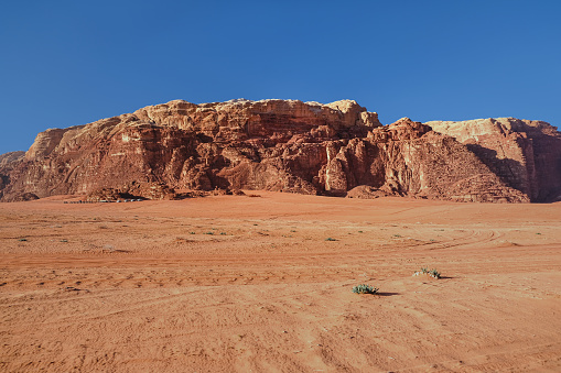 Full frame scenic shot of Sandstone mountain in Wadi Rum desert.  concept : red sand dune, sandstone, granite rock formation, ancient