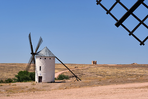 The famous windmills that inspired the giants of Don Quixote of La Mancha. Photograph with the blue and clear sky in summer.