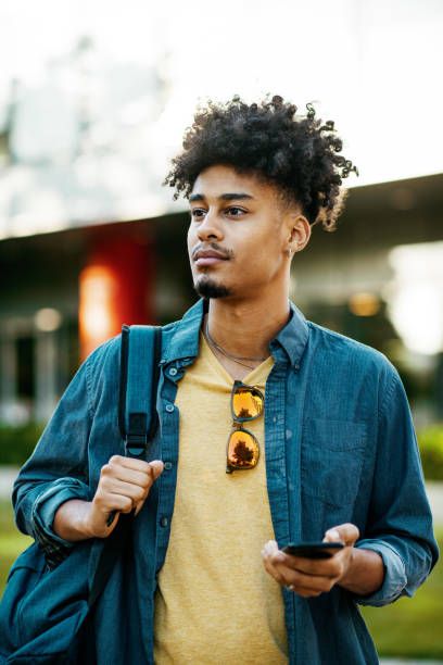 istock African American student in the city, using smart phone 2034990689