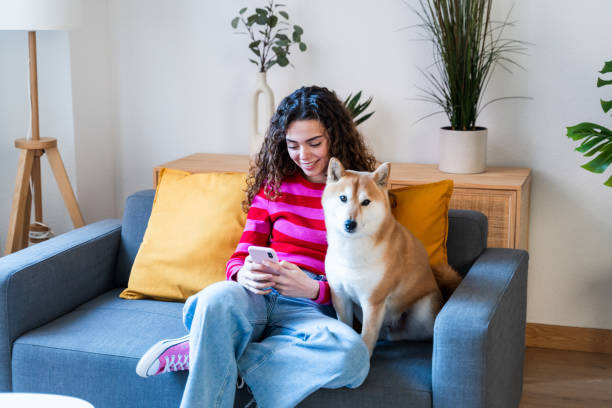 istock Woman and Dog Enjoying Couch Time 2035030263