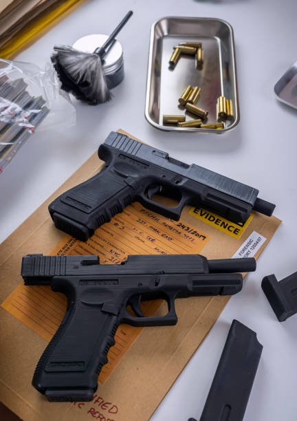 istock Bullet cap along with a gun in ballistic laboratory, conceptual image 2035032417