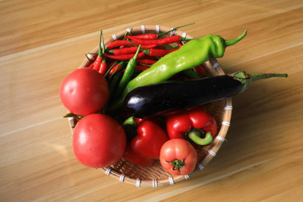 istock Tomatoes, eggplant and pepper are on the chopping board 2035045071