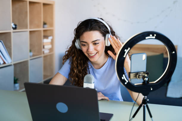 Smiling Woman Waving During a Video Call