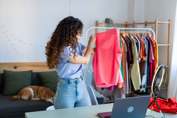 istock Vlogger Presenting Clothing to Online Audience 2035048252