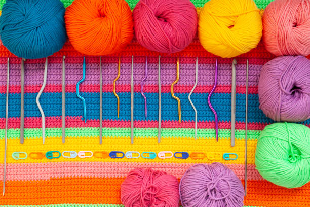 A close-up of a ball of yarn, showcasing the texture and details of the wool, perfect as a wallpaper