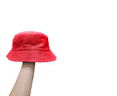 red bucket hat on man's hand