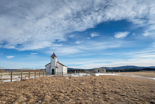 Historic wooden McDougall Memorial United Church and outbuilding on the Stoney Indian Reserve at Morley, Alberta, Canada