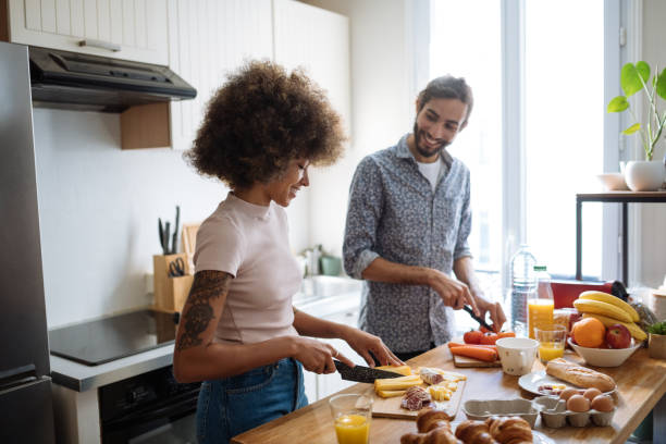 istock Romantic multiracial heterosexual couple in kitchen preparing food 2035094000