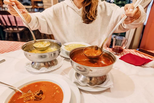 rich flavors of traditional Hungarian goulash, a hearty and comforting soup brimming with tender meat, savory vegetables, and aromatic spices.