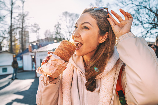 irresistible aroma of freshly baked trdelnik cake, a traditional Czech pastry known for its tantalizing sweetness and unique chimney shape.