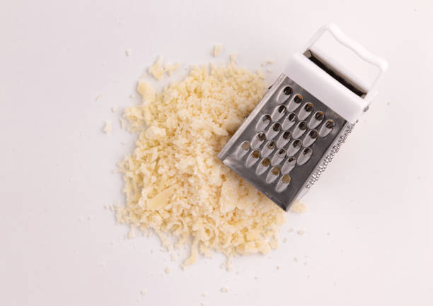 grated parmesan cheese isolated on white background with clipping path, top view