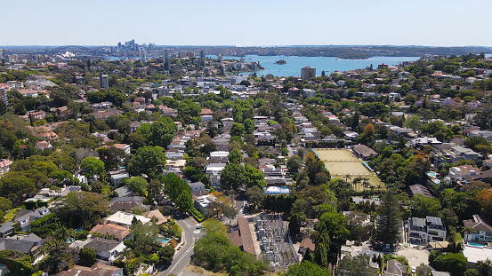 Aerial drone view above the harbourside suburb of Double Bay in east Sydney, NSW Australia looking toward Sydney Harbour on a sunny day