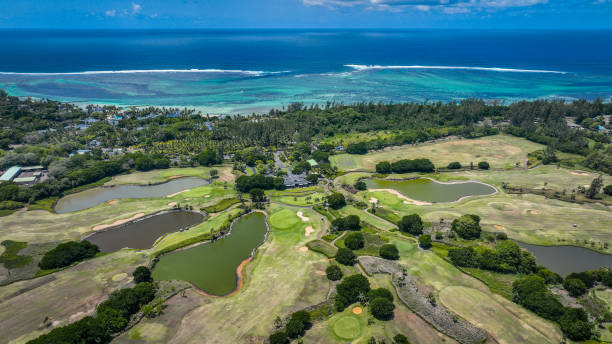 Port Louis, Mauritius - January 11, 2023: An aerial photograph showcasing a golf course located in Mauritius, adjacent to the ocean, capturing the stunning landscape and layout of the course.