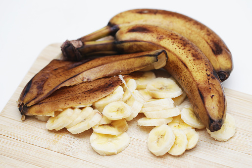 Food scraps use. Healthy smoothie preparation. Rotten brown bananas.
