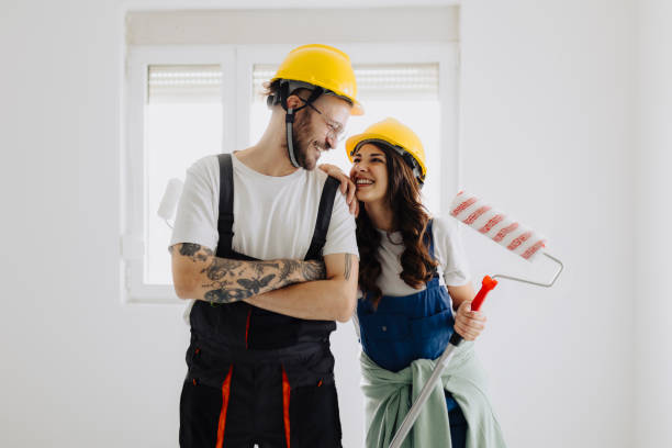 istock Young workers with painting tools indoors. Room renovation 2035247770