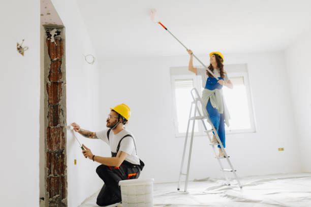 istock Young workers with painting tools indoors. Room renovation 2035259983