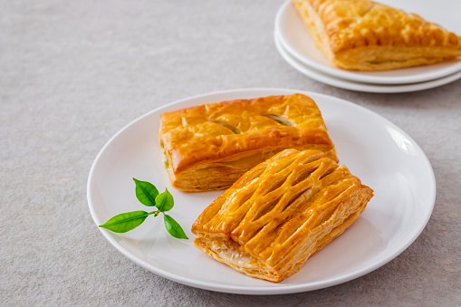 Baked puff pastry on white plate