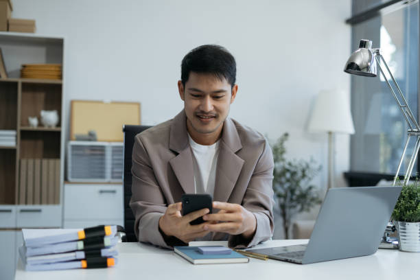 istock Email notification concept, Male use smartphone and laptop receive message alert in the mailbox. 2035288254