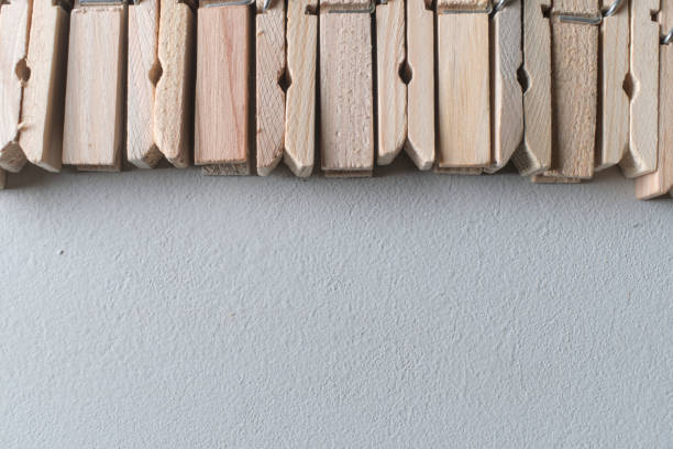 heap wooden clothespins close up. background.