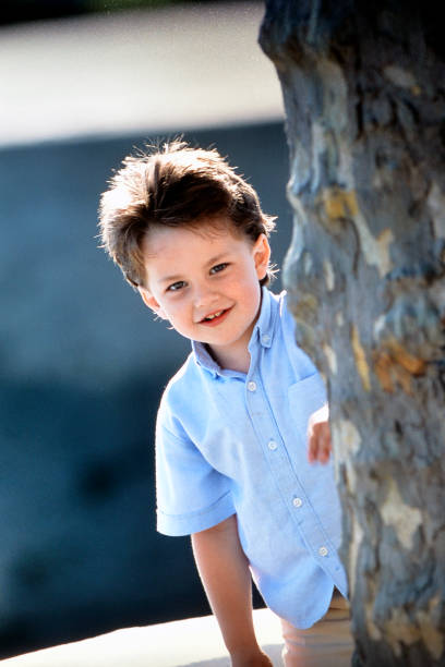 istock Young boy child play hide and seek on july 20/2000 2035316278