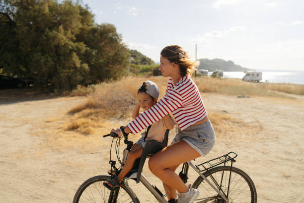 istock Mother and her little boy exploring the coastline on a bicycle 2035316280