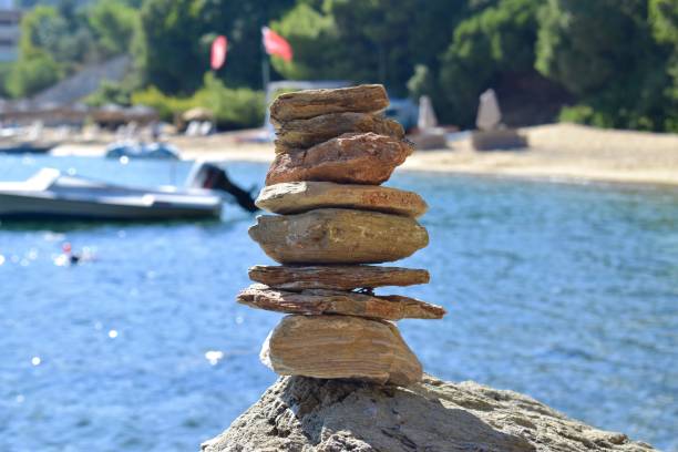 Pyramid of stones. Unstable balance of stone objects. Idyllic state of nature.