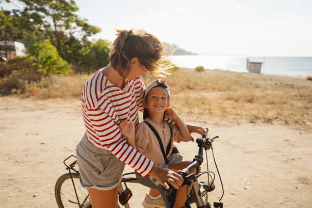 istock Mother and her little boy exploring the coastline on a bicycle 2035316815