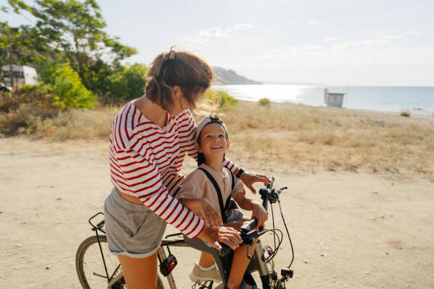 istock Mother and her little boy exploring the coastline on a bicycle 2035317329
