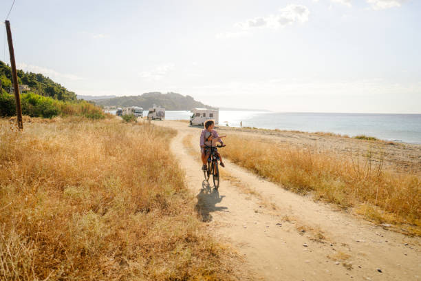 istock Mother and her little boy exploring the coastline on a bicycle 2035320998