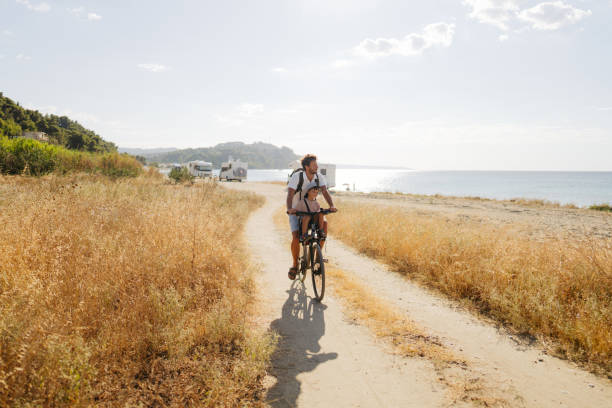 istock Father and son exploring the coastline on a bicycle 2035323399