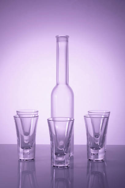 A captivating scene featuring elegant glassware beautifully illuminated by soft backlight, enhanced by helium filters, creating a mesmerizing, luxurious ambiance.