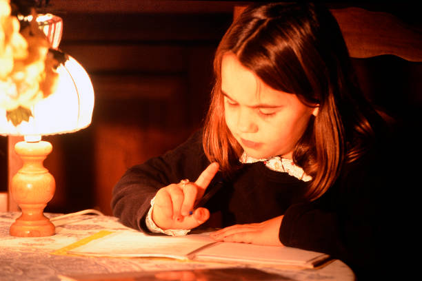 istock young schoolgirl does her homework on september 14 /1999 2035327953