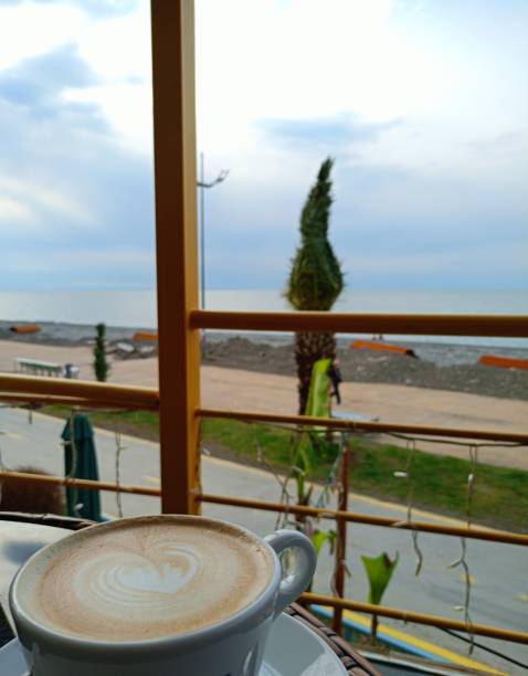 istock cappuccino coffee overlooking the sea coast 2035350834