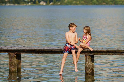 Children on vacation at the sea. Carefree childhood in summer.