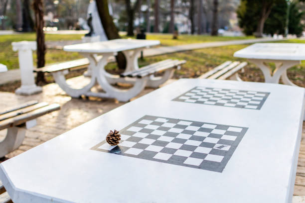 istock Stone chess table in public park at sunset. 2035352707