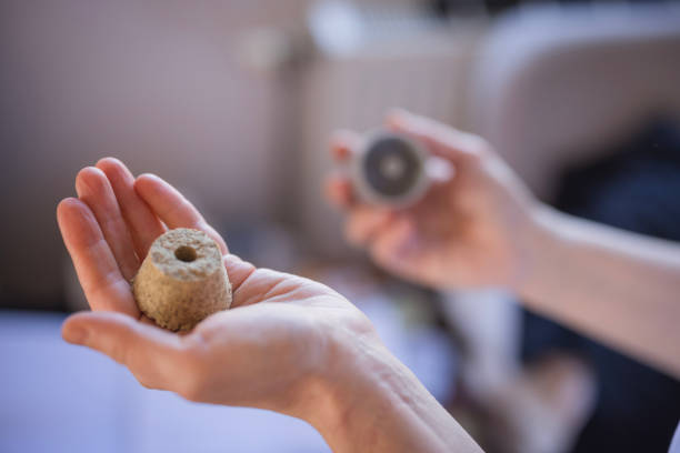 Close-up of female hands preparing herbs for the moxibustion therapy