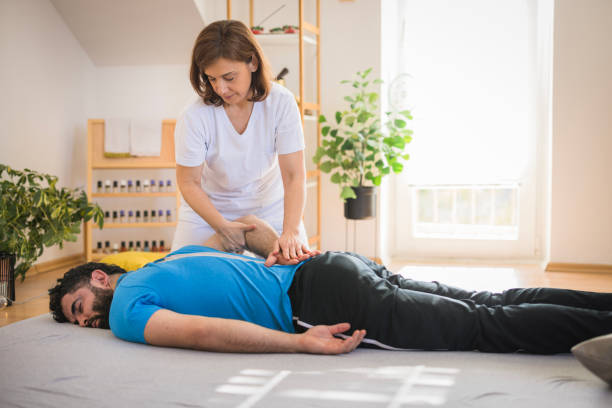 istock Therapist performing shiatsu back massage 2035377052