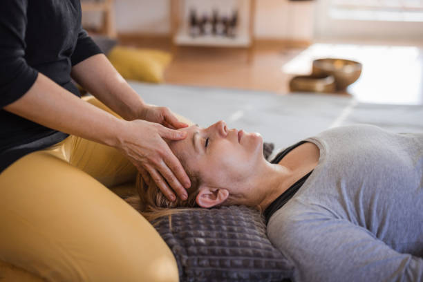 istock Woman getting rid of headache with face massage 2035382006