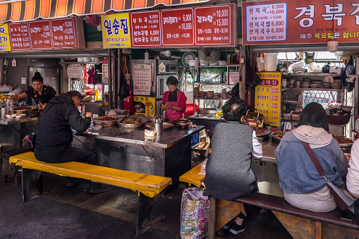 busan, south korea - november 1, 2023: fresh seafood restaurants at famous jagalchi fishmarket in the seconds largest city of south korea. busan has a huge harbor and the biggest fishmarket in south korea. busan will have the worldexpo 2030.