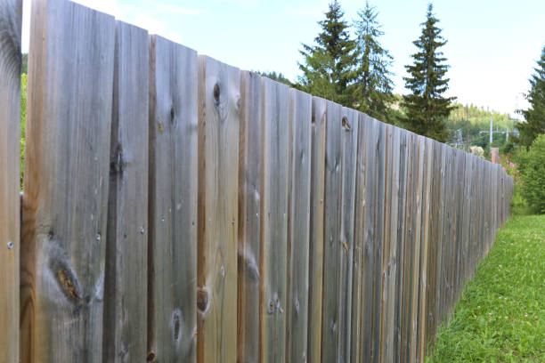 istock Solid wooden fence in the village in summer. 2035405054