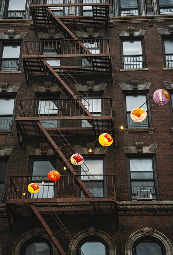 New York City style apartment buildings with  Fire escape stairs in Chinatown  Manhattan, New York