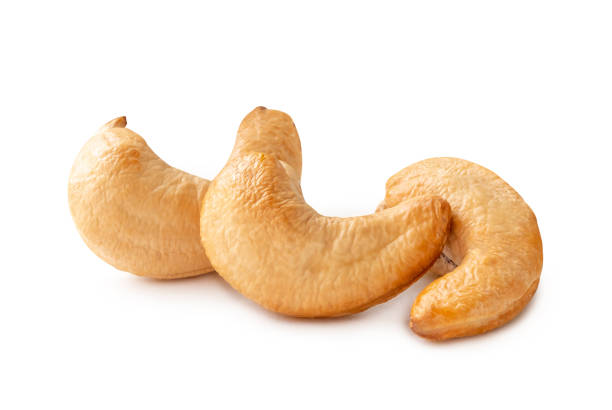 istock Front view of three Roasted brown cashew nuts in stack isolated on white background with clipping path 2035408062