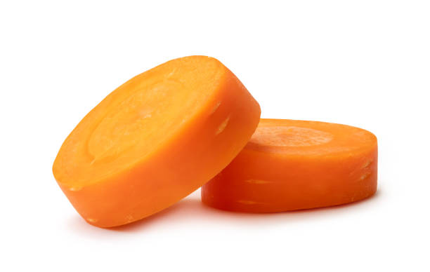 istock Front view of beautiful orange carrot slices in stack isolated on white background with clipping path 2035410757